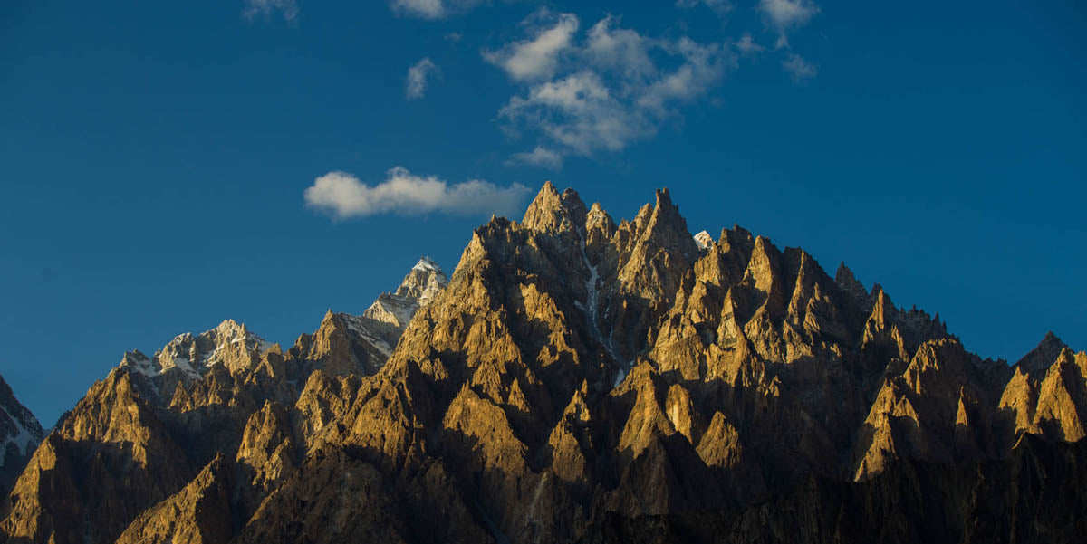 Stunning mountain range with sharp peaks under a clear blue sky